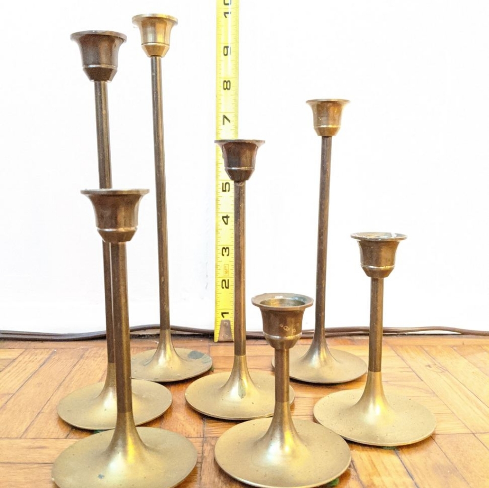 7 brass candle sticks.